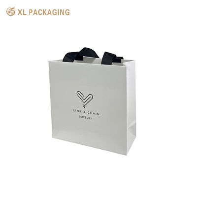 comprar Bolsas de compras de papel de hotel desechables personalizadas con mangos de cinta de algodón Fabricación en línea