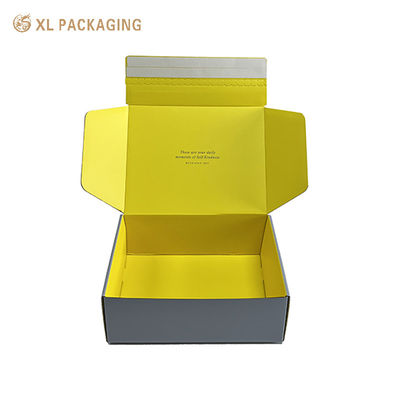 Cajas de correo corrugadas impresas a medida para cosméticos. Cajas de envío gris y amarillo de lujo con logotipo.