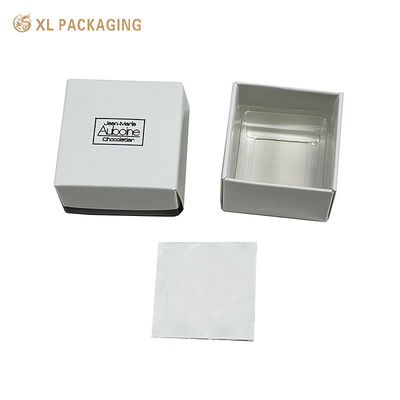 Caja de bombones de lujo con relieve blanco y bandeja de PET, caja de regalo de dulces plegable de dos piezas, plana, con estampado de lámina negra
