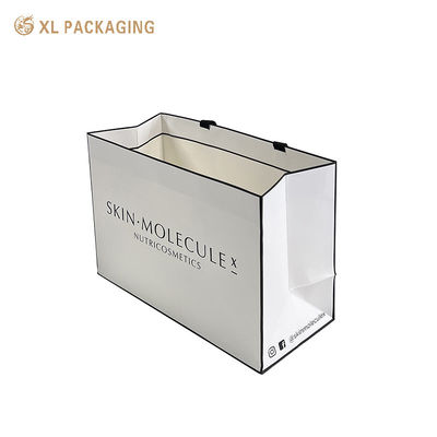 Logotipo personalizado Bolsa de papel cosmético de lujo con 350 gramos de cartón blanco, laminación mate y mangos de algodón