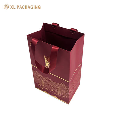 Bolsa de regalo de lujo ecológica de primera calidad con estampado de papel de oro y mangos de cinta reforzados para embalajes personalizados